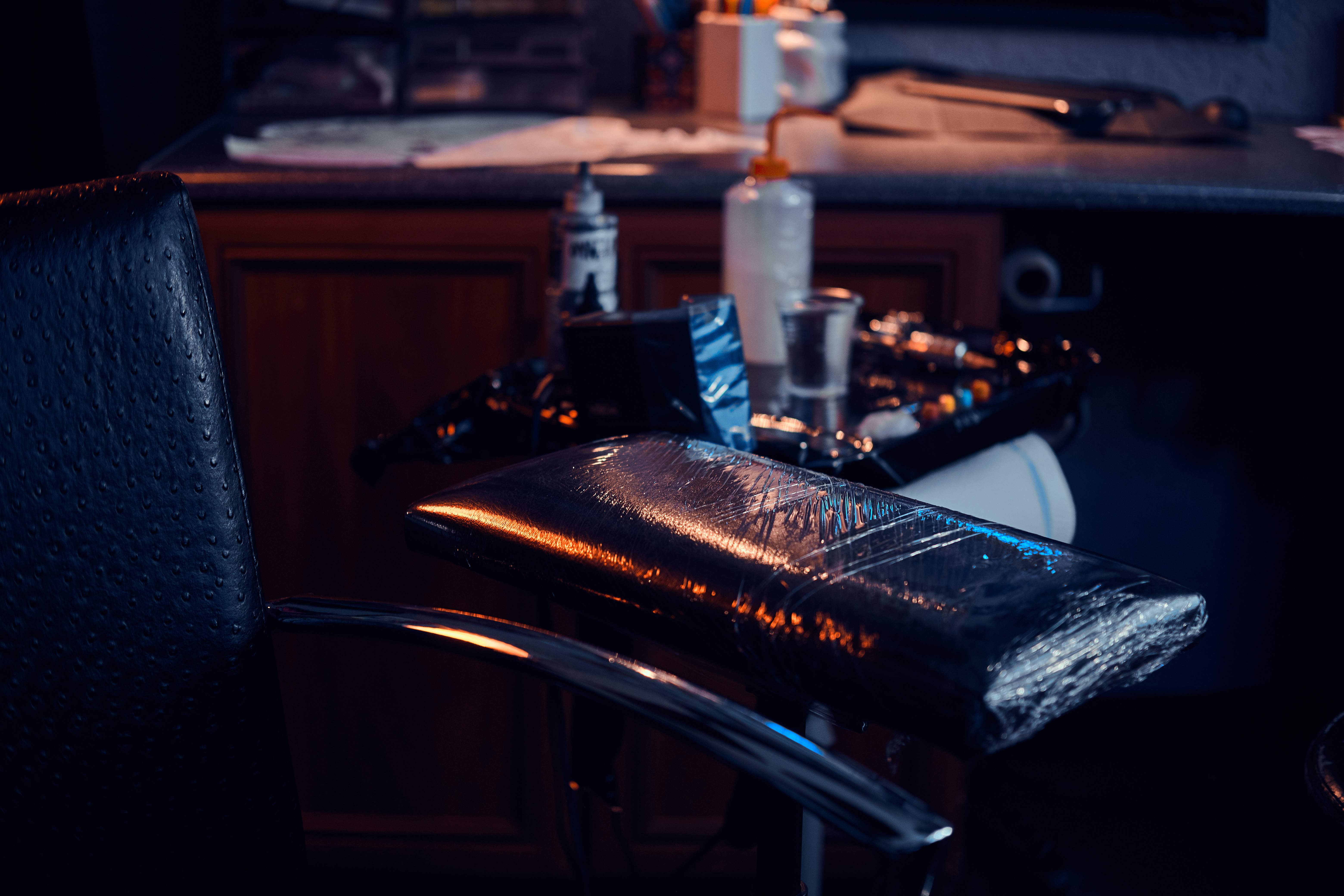 Tattoo artist working in studio